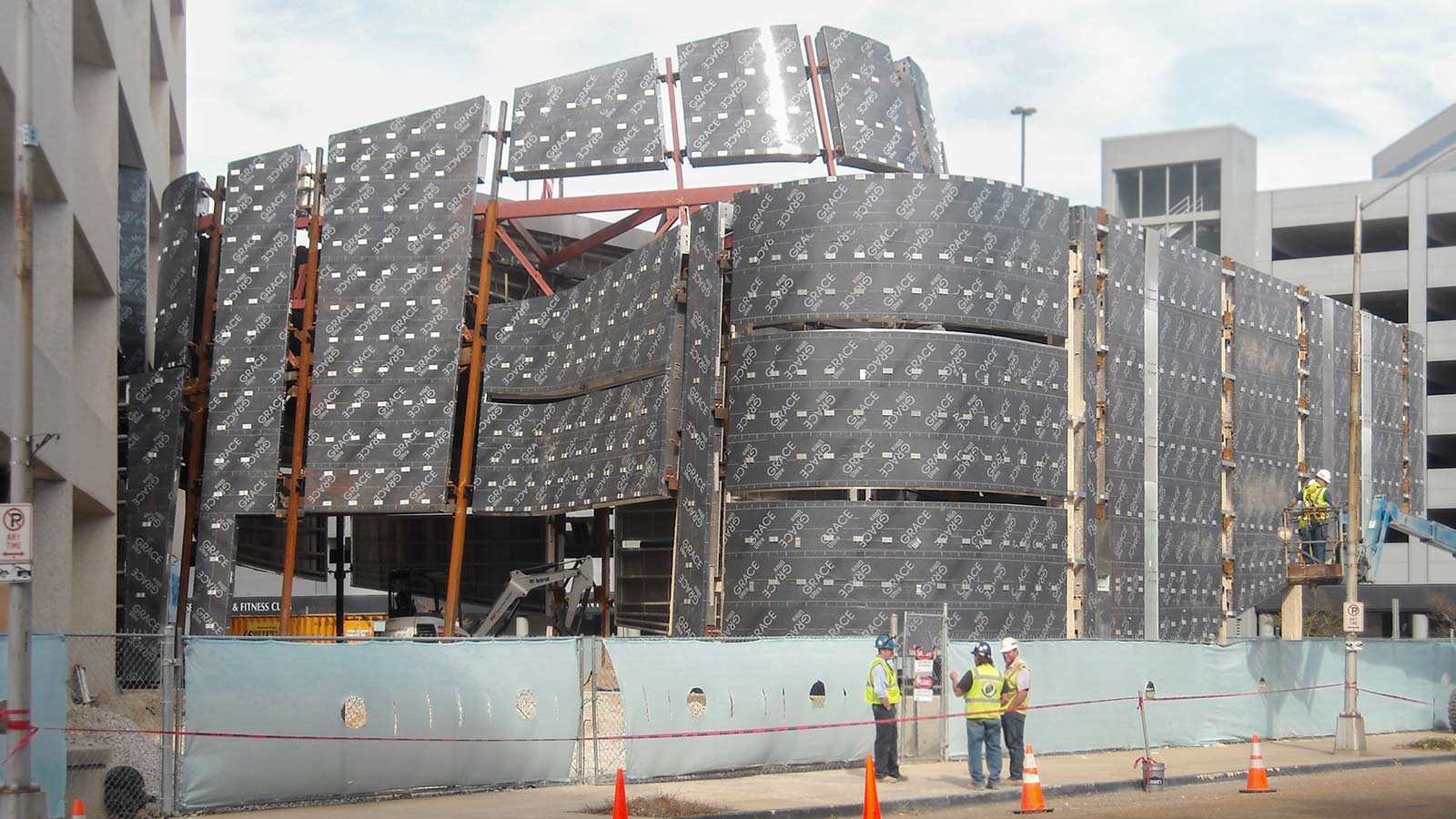 ZEPPS understructure visible as Zahner field operators prepare to install the lites of glass.