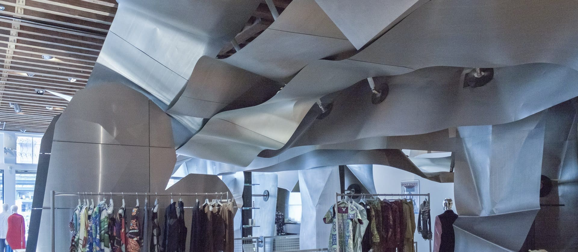 Curving titanium drop ceiling at Issey Miyake Tribeca.