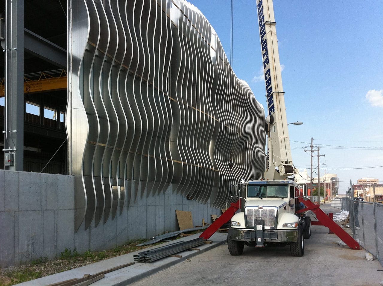 A crane is used to hoist each panel into place.