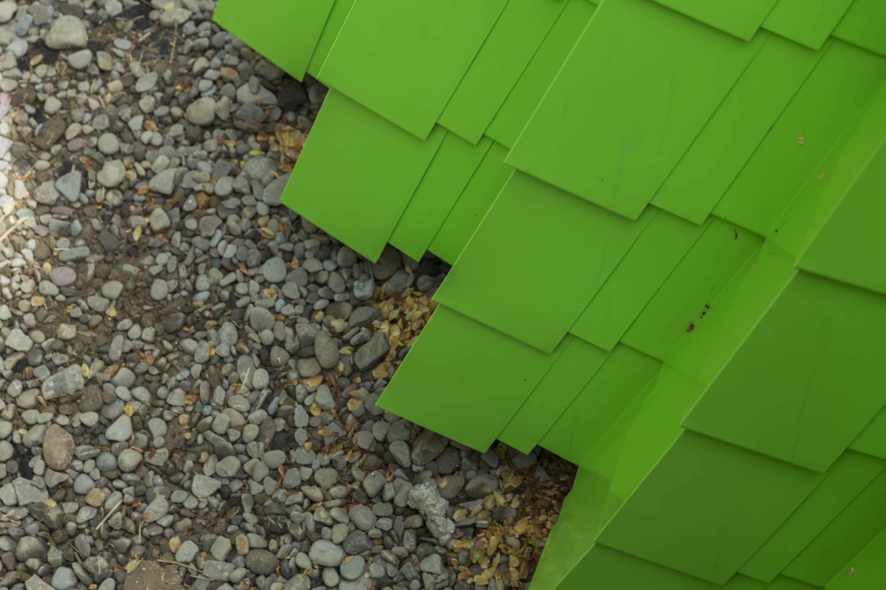 Detail of the painted aluminum shingles at grade.