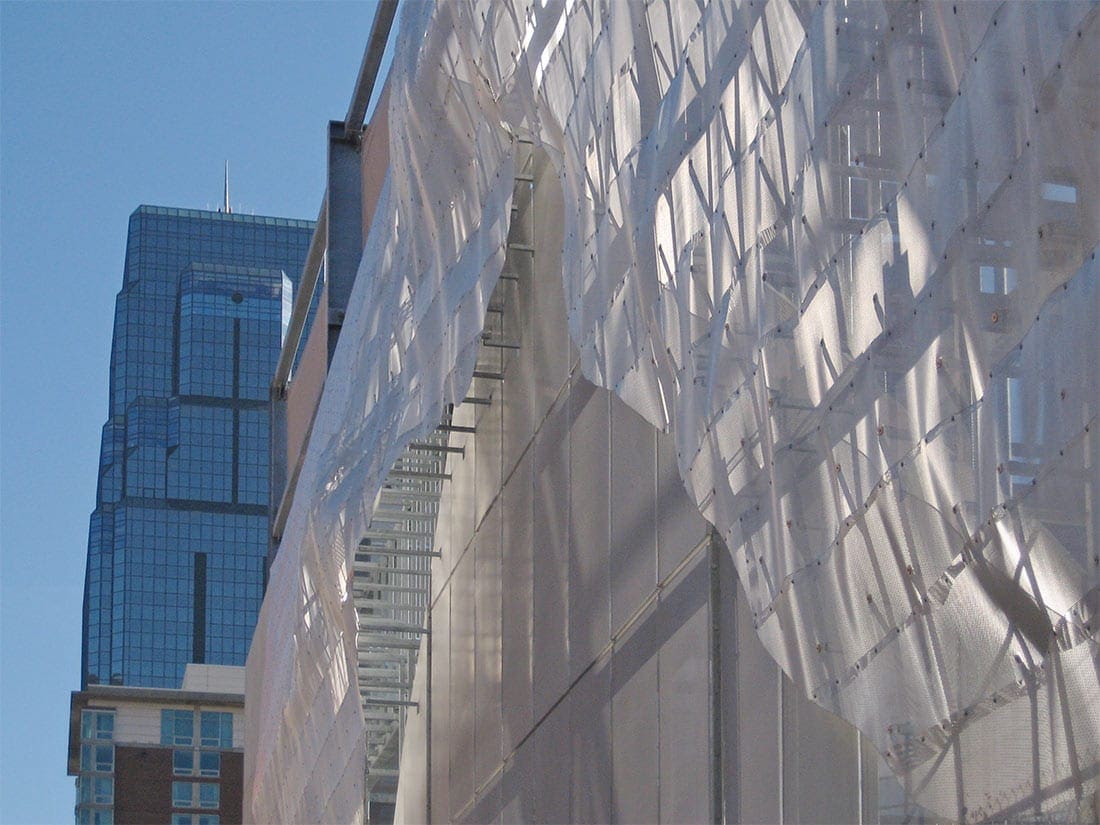 Light filters through the Winds of Aphrodite's aluminum surface on Bartle Hall Loading Dock.