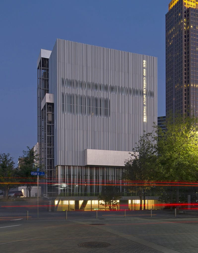 Wyly Theatre at dusk with lit signage.