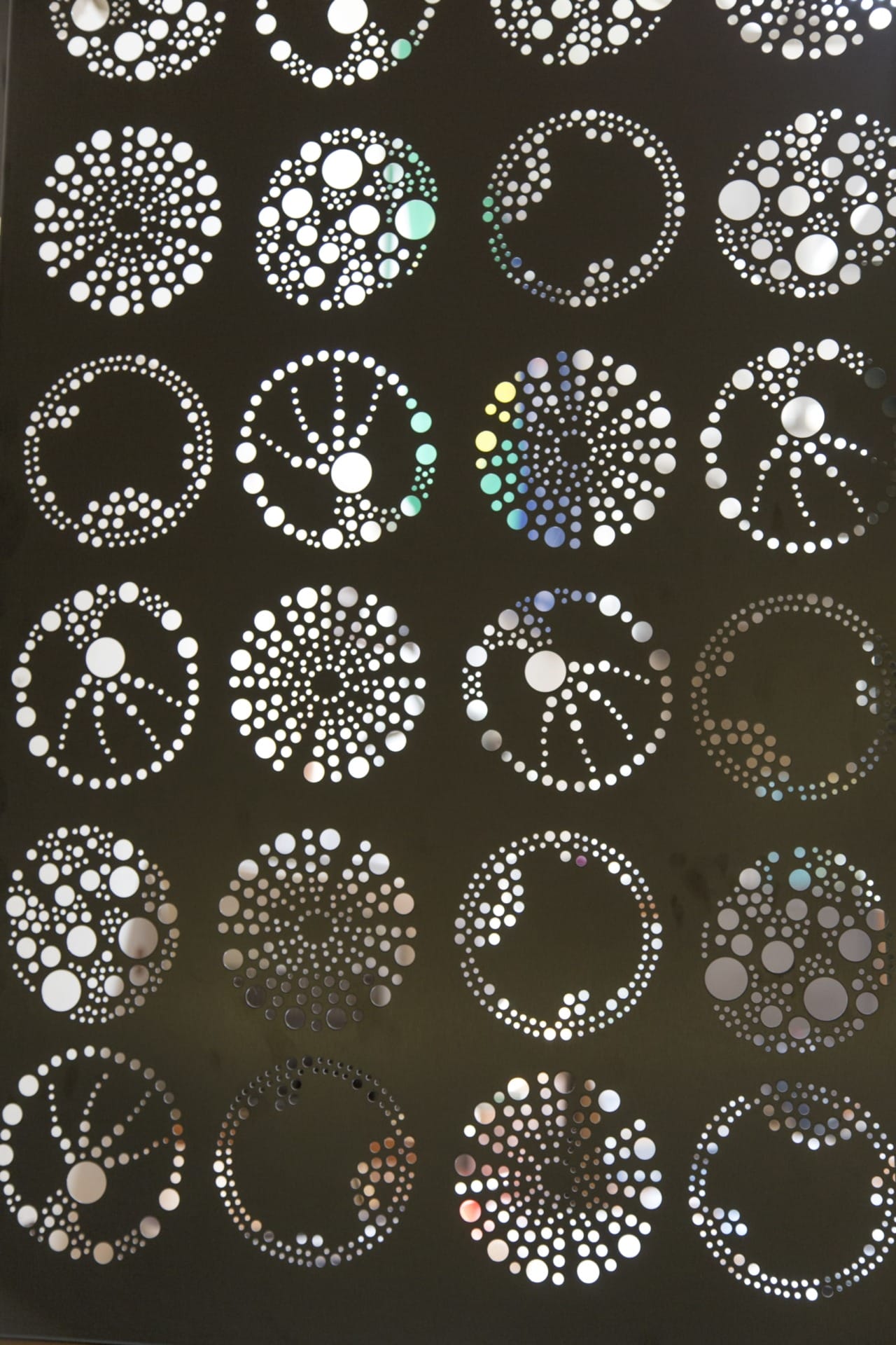 Detail of the custom perforated iconography at the Exploratorium.