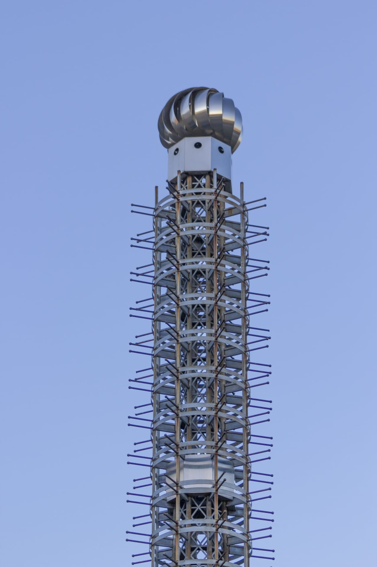 Spinning roof turbine vent tops the Sport Stacks artwork by R.M. Fischer