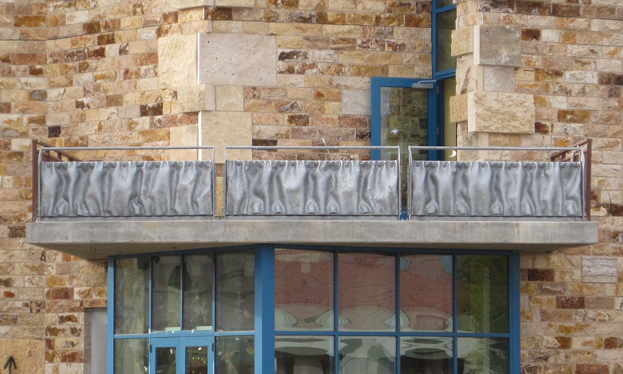 Detail of the custom undulated steel curtains used on the Center for the Arts at NMSU