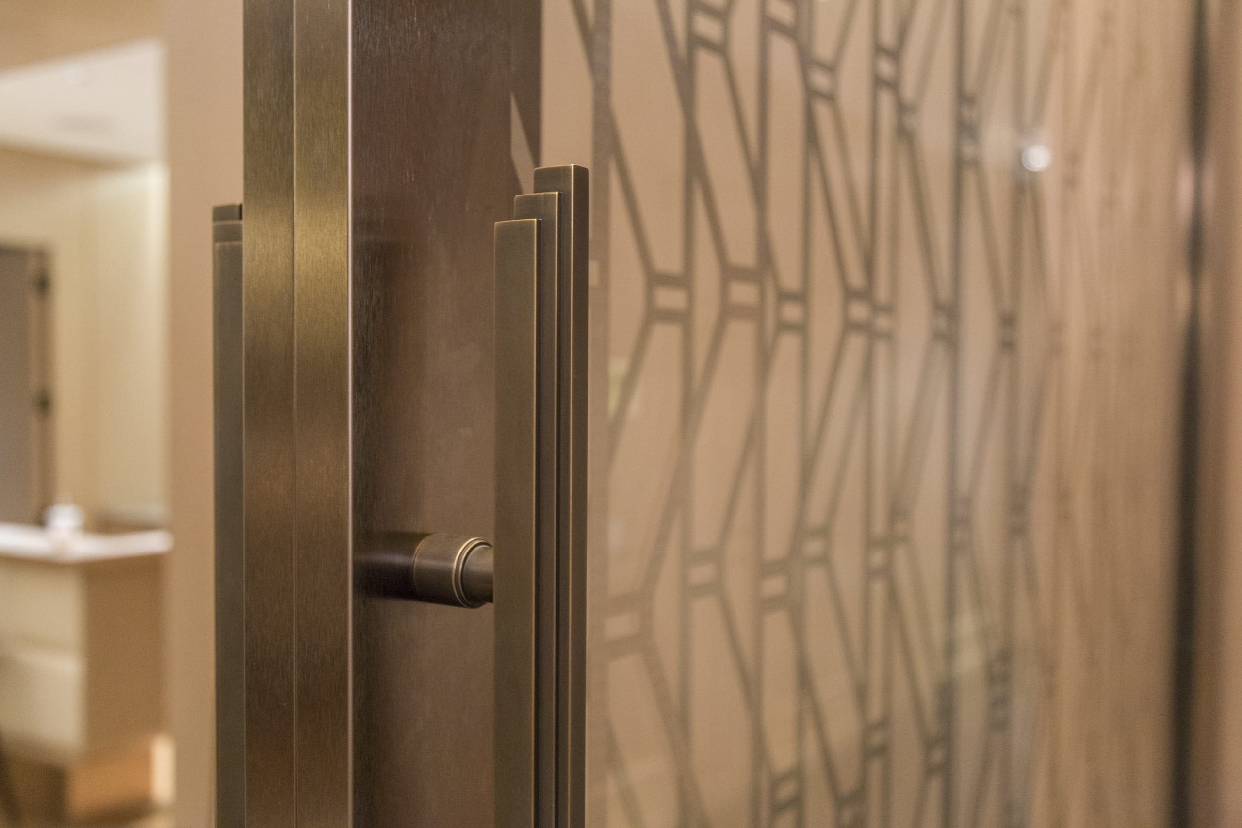 Detail of the bronze door hardware for the custom sliding lounge.