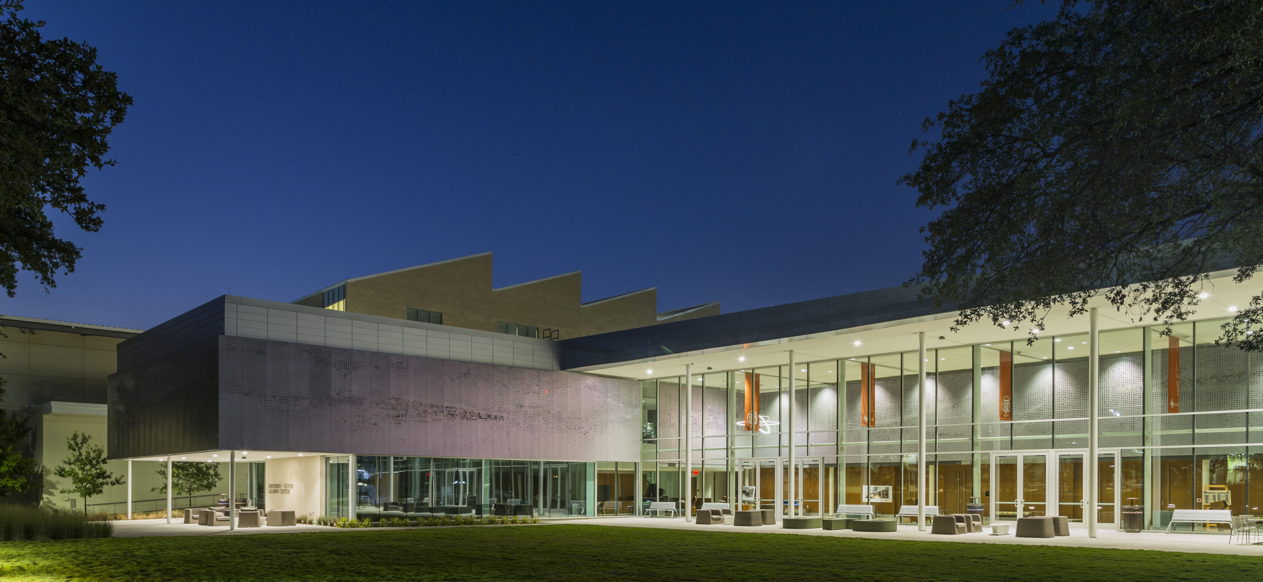 Exterior of Davidson-Gundy Alumni Center at night.