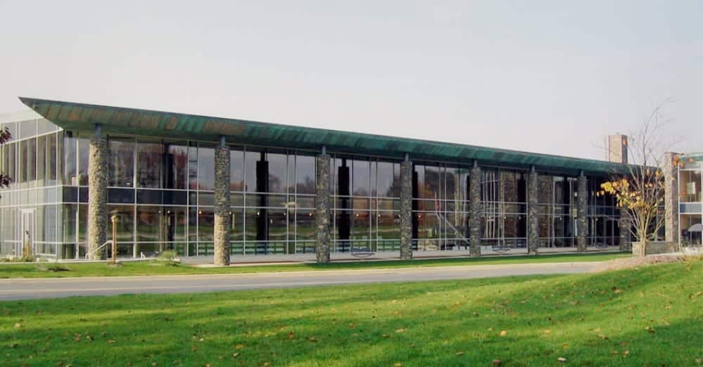 Prepatinated copper canopy caps the colonnade for Brandywine Hundred Library