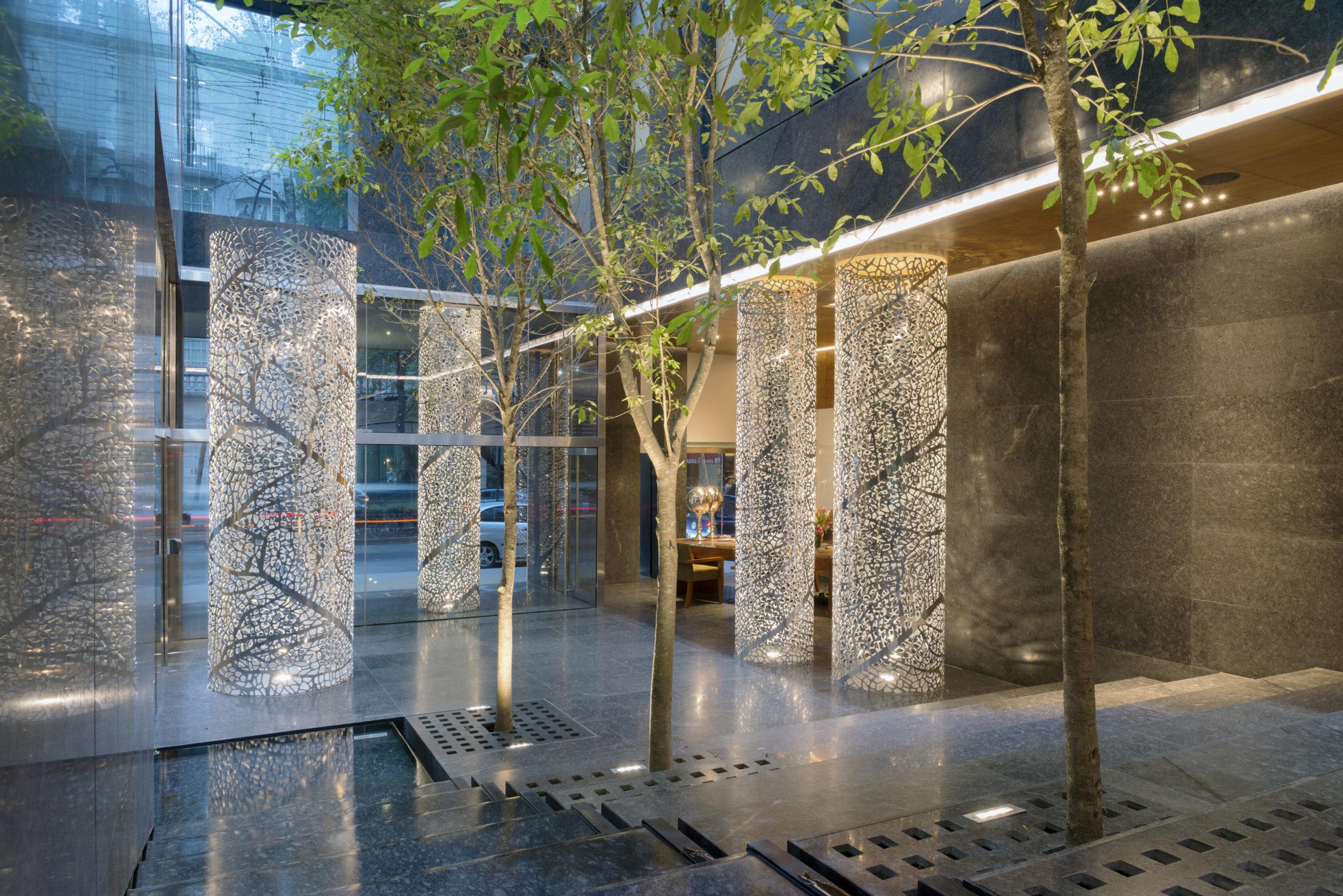 Perforated aluminum columns adorn the entrance of Artesia.