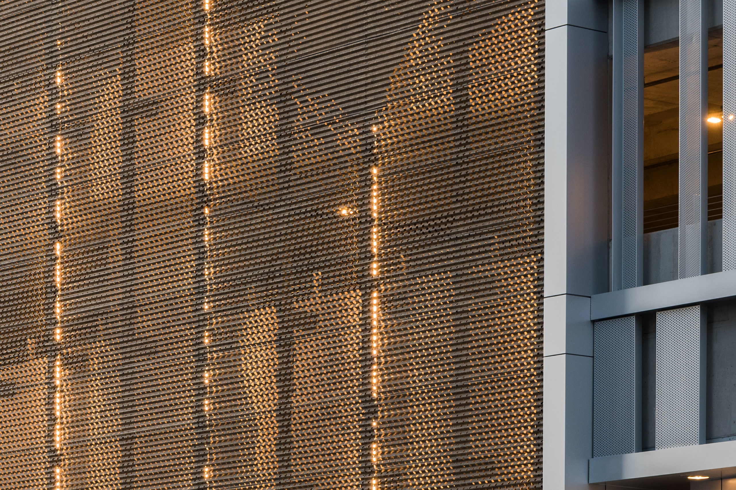 Detail of the perforated and corrugated metal surface at 1401 Lawrence.