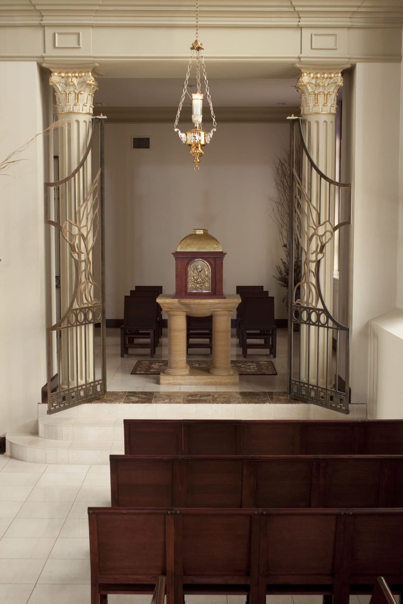 The interior metal gate open in the church's interior.