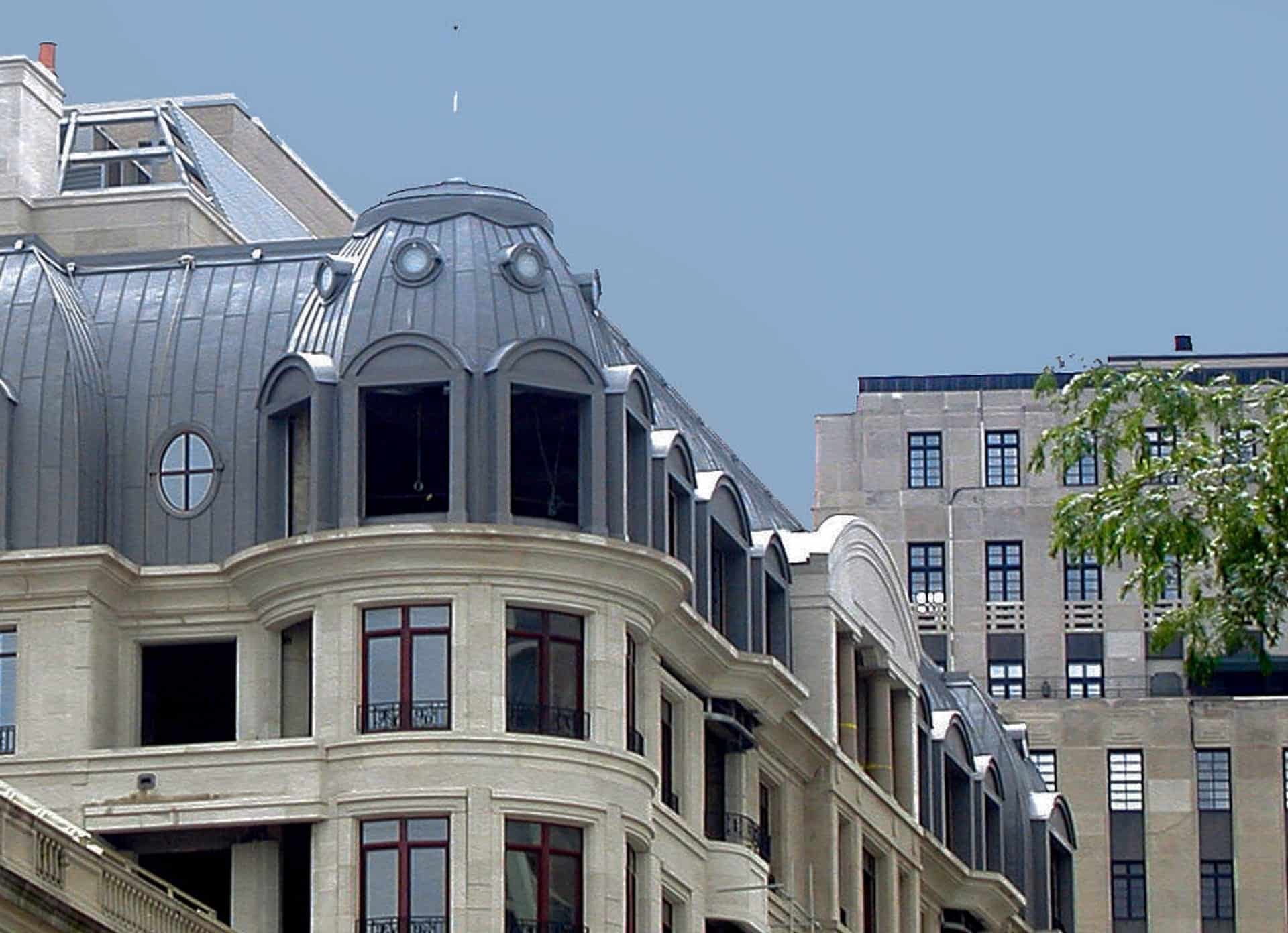 The Lucien Lagrange-designed 65 E. Goethe Building with Zinc Roof, an example of how traditions in architecture can benefit from modern scale fabrication and engineering technologies.